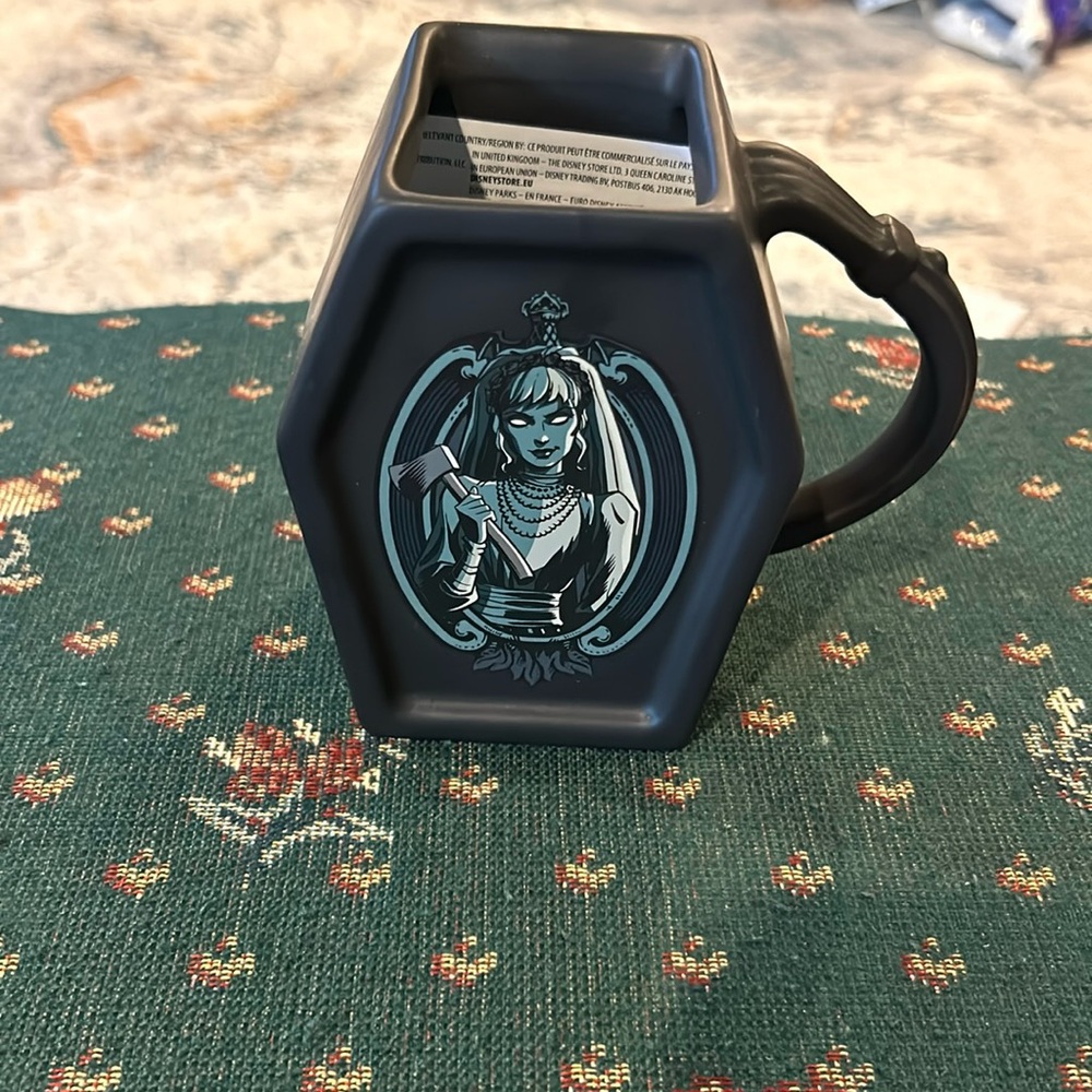 Disney’s Haunted Mansion coffin shaped coffee mug, approximately 5“ x 3 black